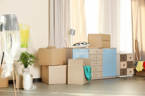Removal team loading boxes and furniture for a house move