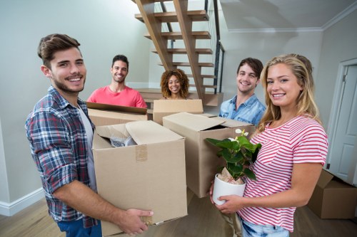 Home moving service in Shoreditch with packed boxes and furniture ready for loading