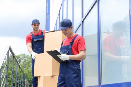 Professional moving service preparing furniture and boxes for transport in Shoreditch