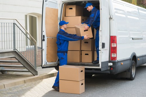 Packed household items prepared for transport by removals staff