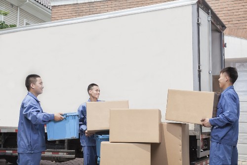 Trained removals staff preparing for safe lifting