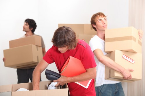 Helper carrying office items during a Shoreditch move