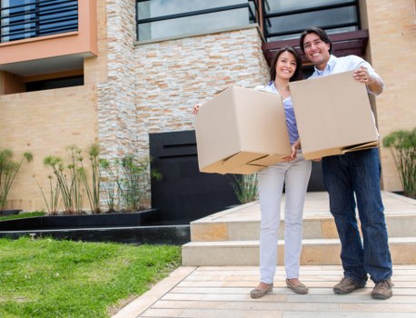 Boxes and furniture being organised for transport during a local house removal