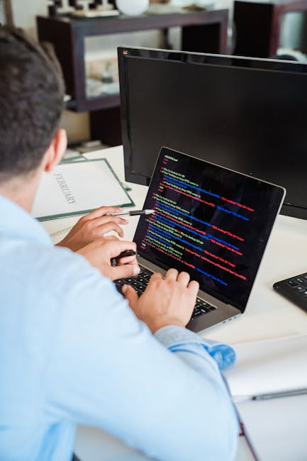 A computer screen displaying lines of HTML code, including tags such as <html>, <head>, <title>, and <body>, with visible syntax highlighting in various colors. The code appears to be part of a websit